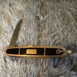 Imperial Stainless Steel Pocketknife Black And Gold Manual Plain Edge. Fixed Price $61.00.